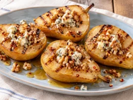 Grilled pears with blue cheese, hot honey, and toasted walnuts.