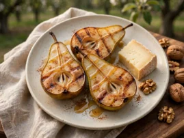 Grilled pears with honey and cinnamon, served with cheese and walnuts.